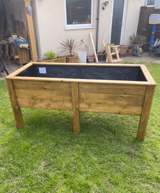 Raised wooden planter for flowers or vegetables with planting depth approx 42cm.v